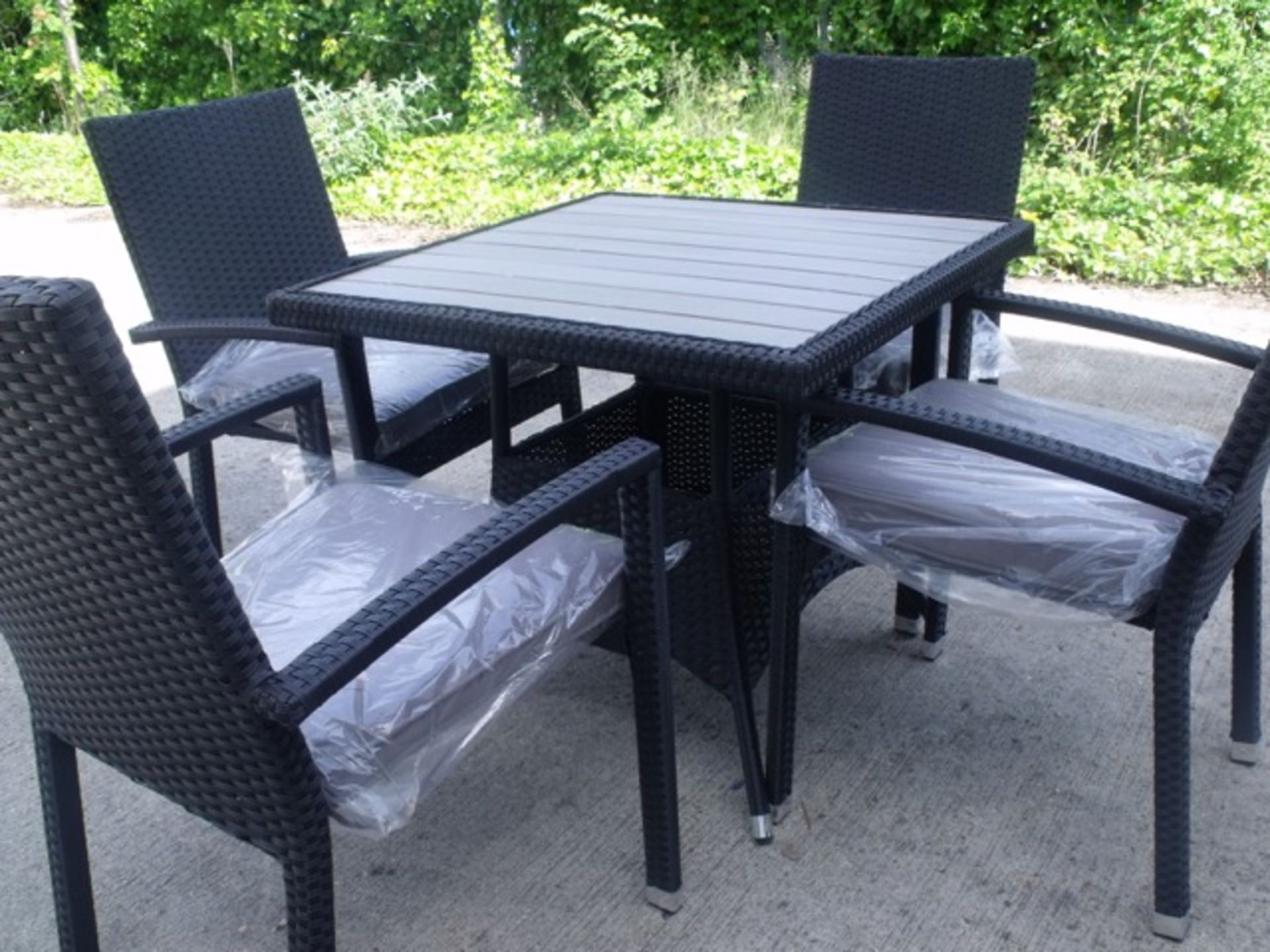 5 Piece Rattan Dinning Set - 4 x Stackable Alu arm chairs, Table with Polywood top