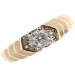 A 14ct gold diamond single-stone ring. The brilliant-cut diamond and similarly-cut diamond chevron