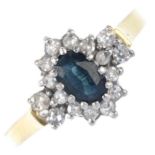 An 18ct gold sapphire and diamond cluster ring. The oval-shape sapphire, within a single-cut diamond