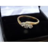 18 Carat Yellow Gold 3 Stone 0.25 Carat High Quality Diamond Crossover Ring. Total Piece Weight