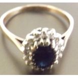 A Saphire and Diamond cluster ring, A stunning Blue Sapphire surrounded by diamonds, set in 9