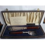 Vintage Cased Fish Knife & Fork EPNS or Silver Plate in Dark Wood Box together with Card Dated 1945.