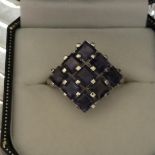 Very large 10 ct white gold ring with tanzanites