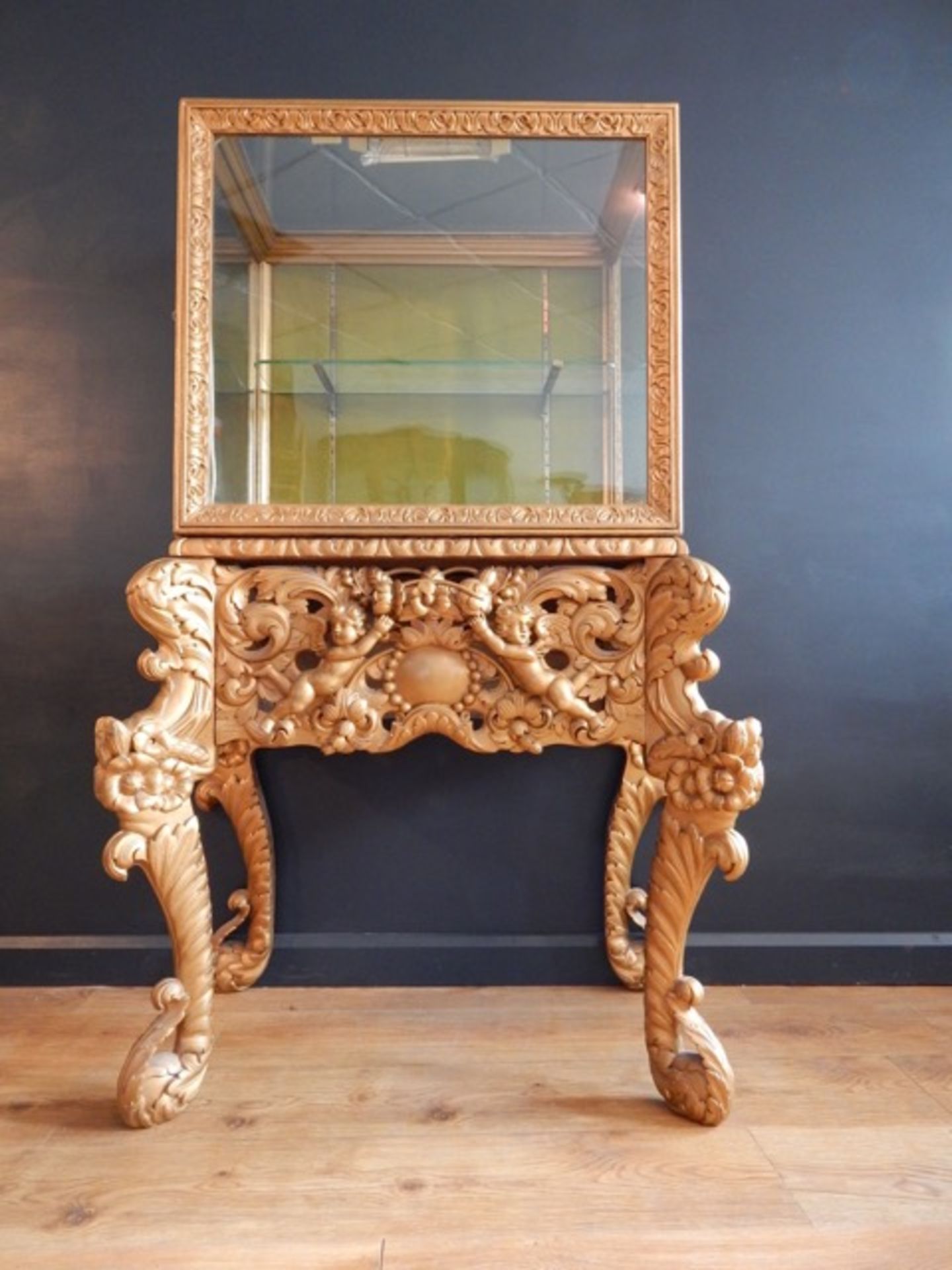 GILTWOOD CABINET ON PUTTI STAND
Condition: Original Finish Overpainted, pine or Limewood Base.