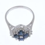 An 18ct gold sapphire and diamond cluster ring. The single-cut diamond, within a circular-shape