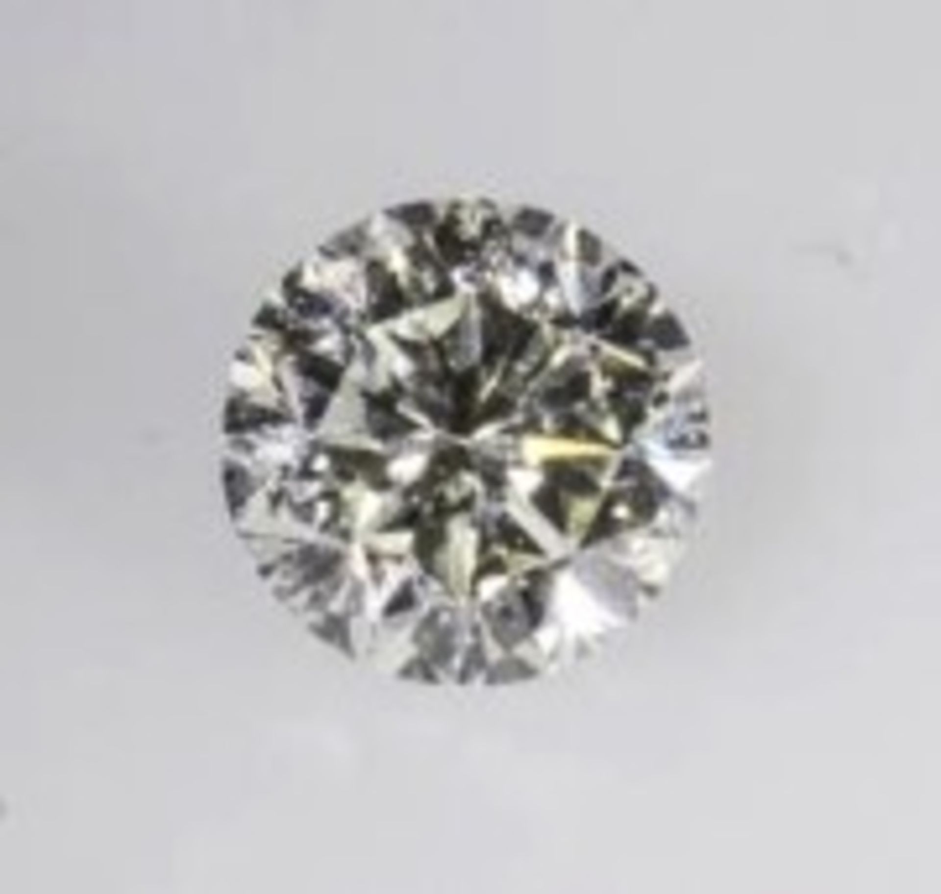 A 0.11 Carat round, brilliant cut diamond. Please add £4.10 to final hammer price for postage &