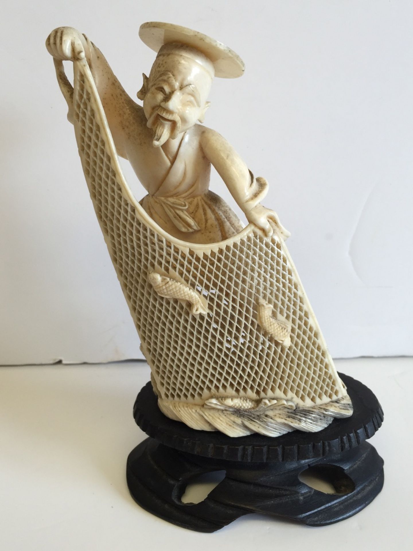 A Meiji Period Japanese Ivory Carving of a Fisherman