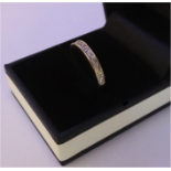 A 9ct gold half eternity ring, with around .33ct of diamonds - size p/q ( TWC 0.33 ,  GW 2 )