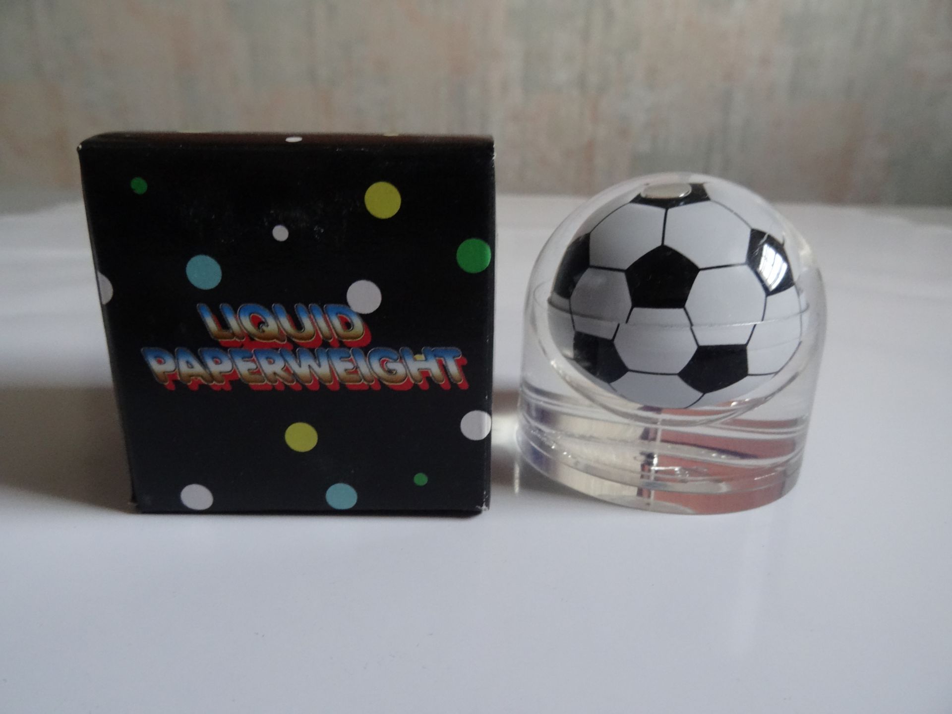 Novelty Liquid Paperweight Football x 90 Units