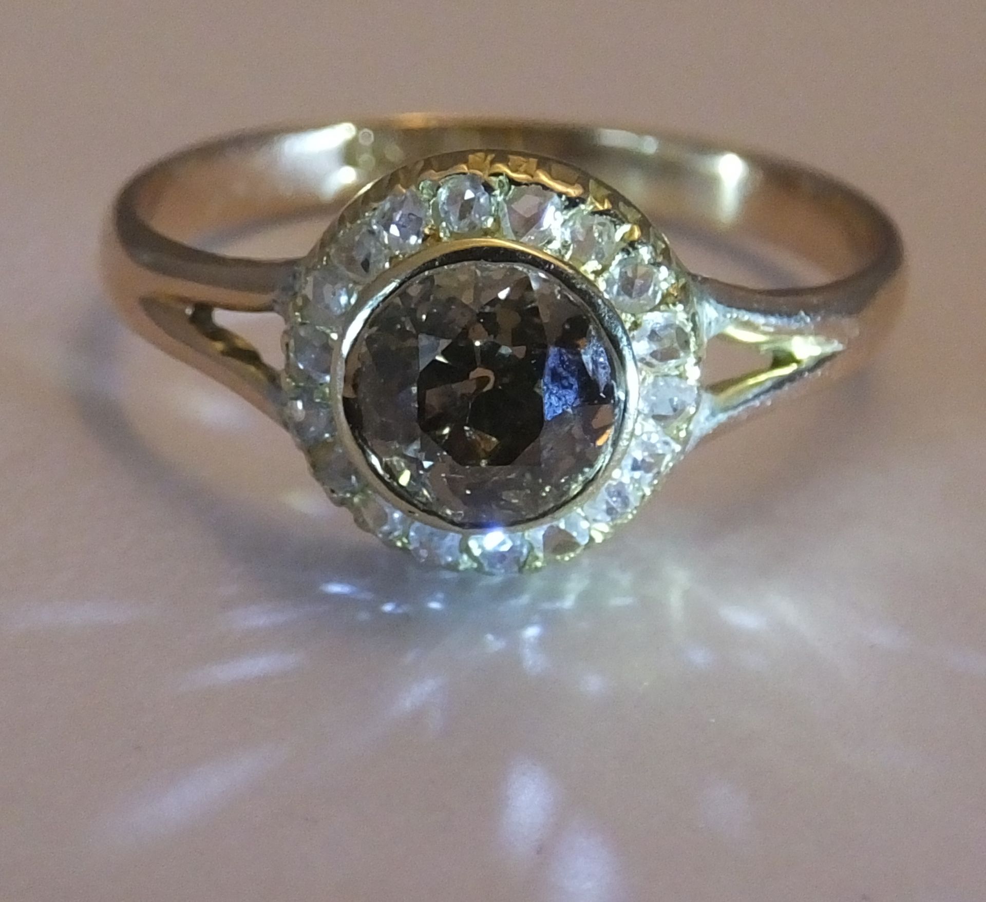 A coloured diamond and diamond cluster ring. Size R. The old-cut 'brown' diamond, within a rose- - Image 2 of 4
