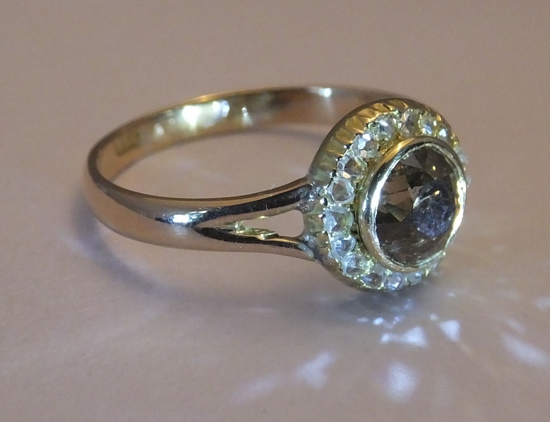 A coloured diamond and diamond cluster ring. Size R. The old-cut 'brown' diamond, within a rose- - Image 4 of 4