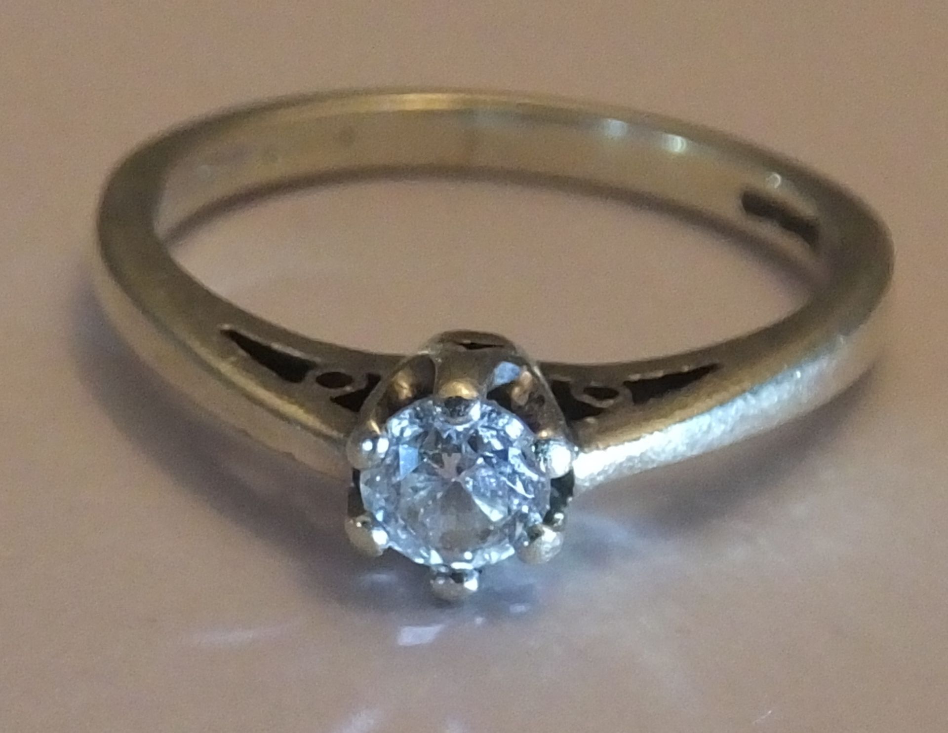 An 9ct White gold Diamond Ring. Size 0. A brilliant cut solitaire diamond of around 0.33 carat.