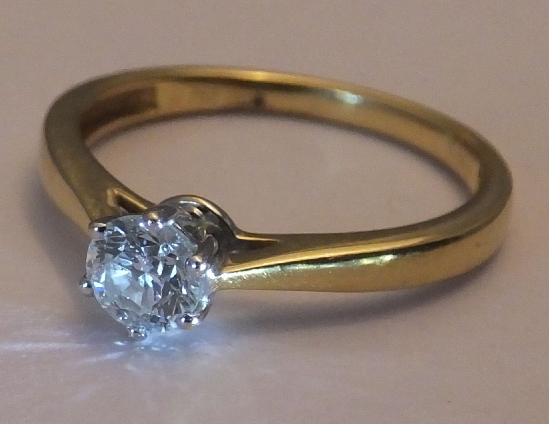 An 18ct gold diamond single-stone ring. The brilliant-cut diamond, to the plain band. - Image 3 of 3