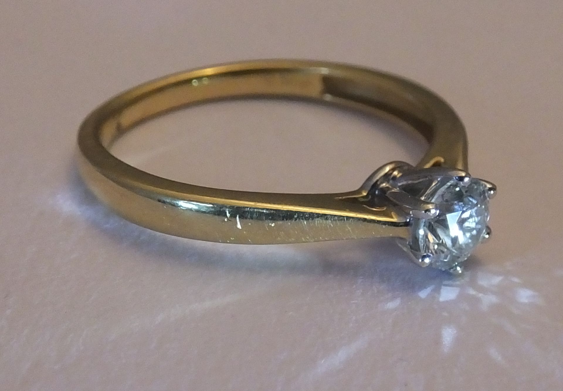 An 18ct gold diamond single-stone ring. The brilliant-cut diamond, to the plain band. - Image 2 of 3