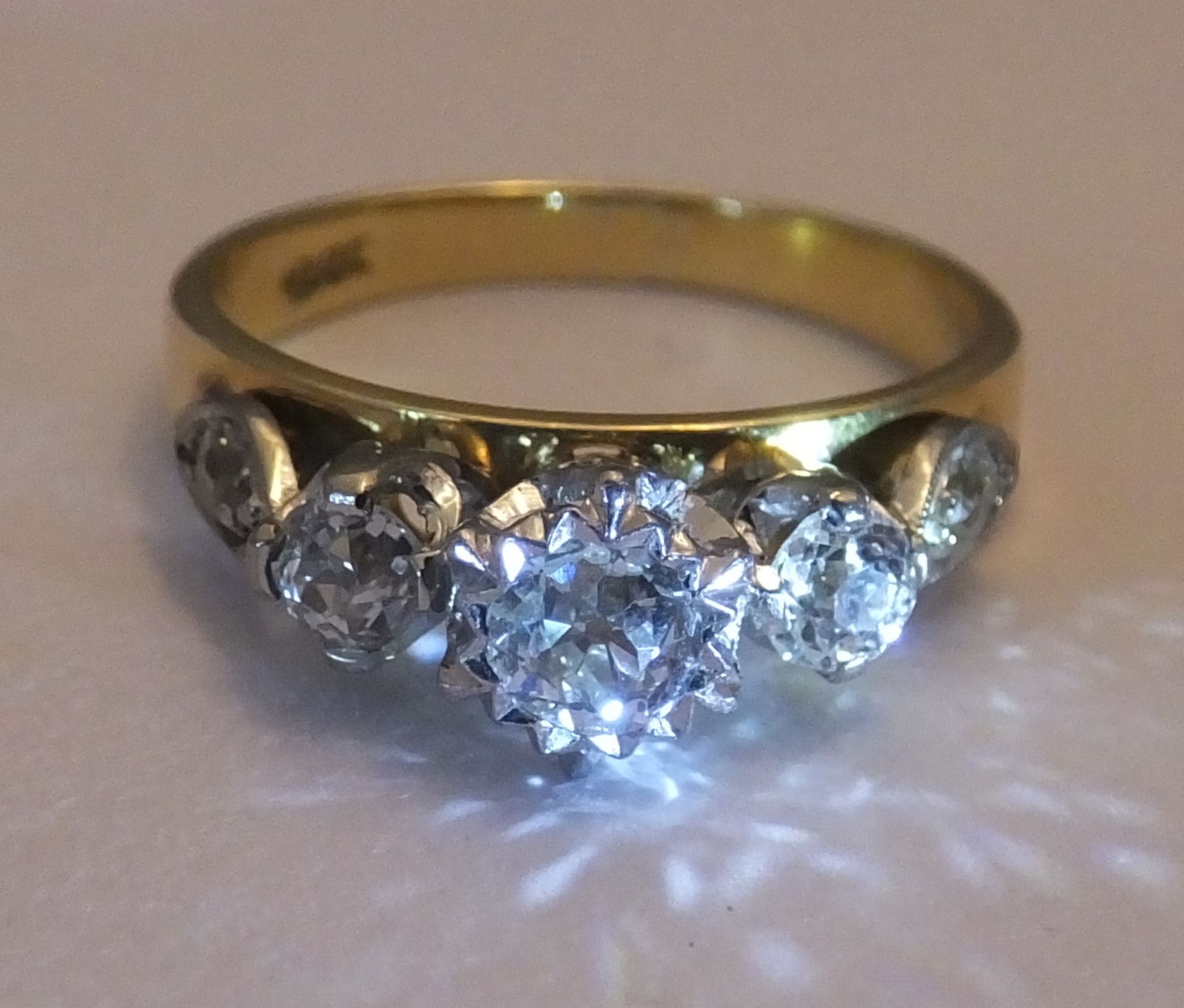 An 18ct Gold 5 stone ring. 1ct of old mine cut diamonds set in 18 carat gold