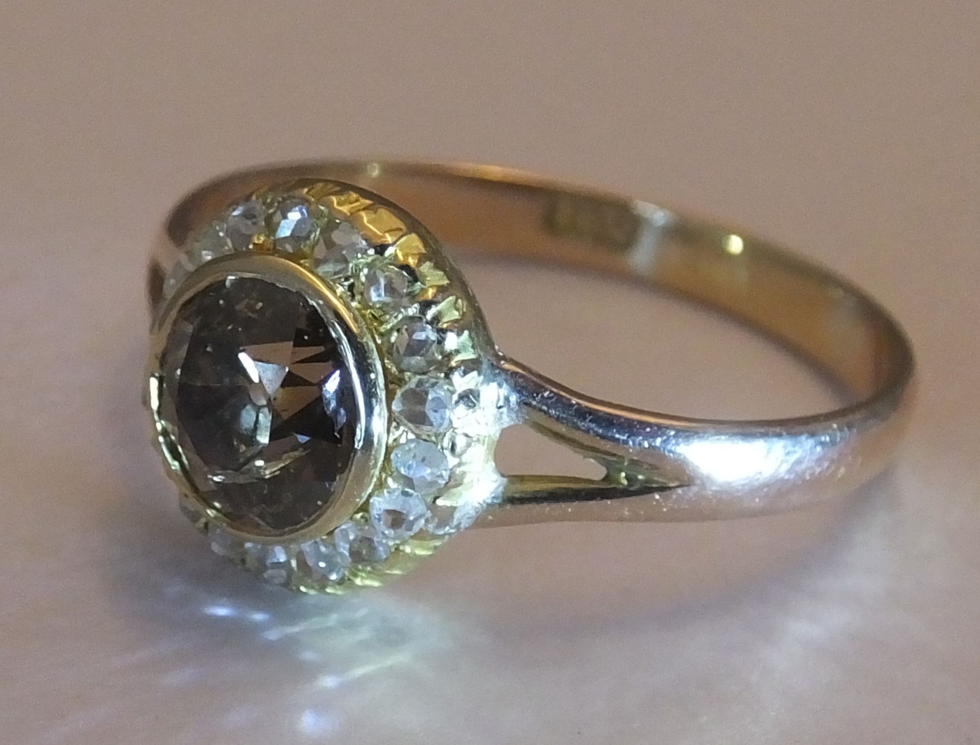 A coloured diamond and diamond cluster ring. Size R. The old-cut 'brown' diamond, within a rose- - Image 3 of 4
