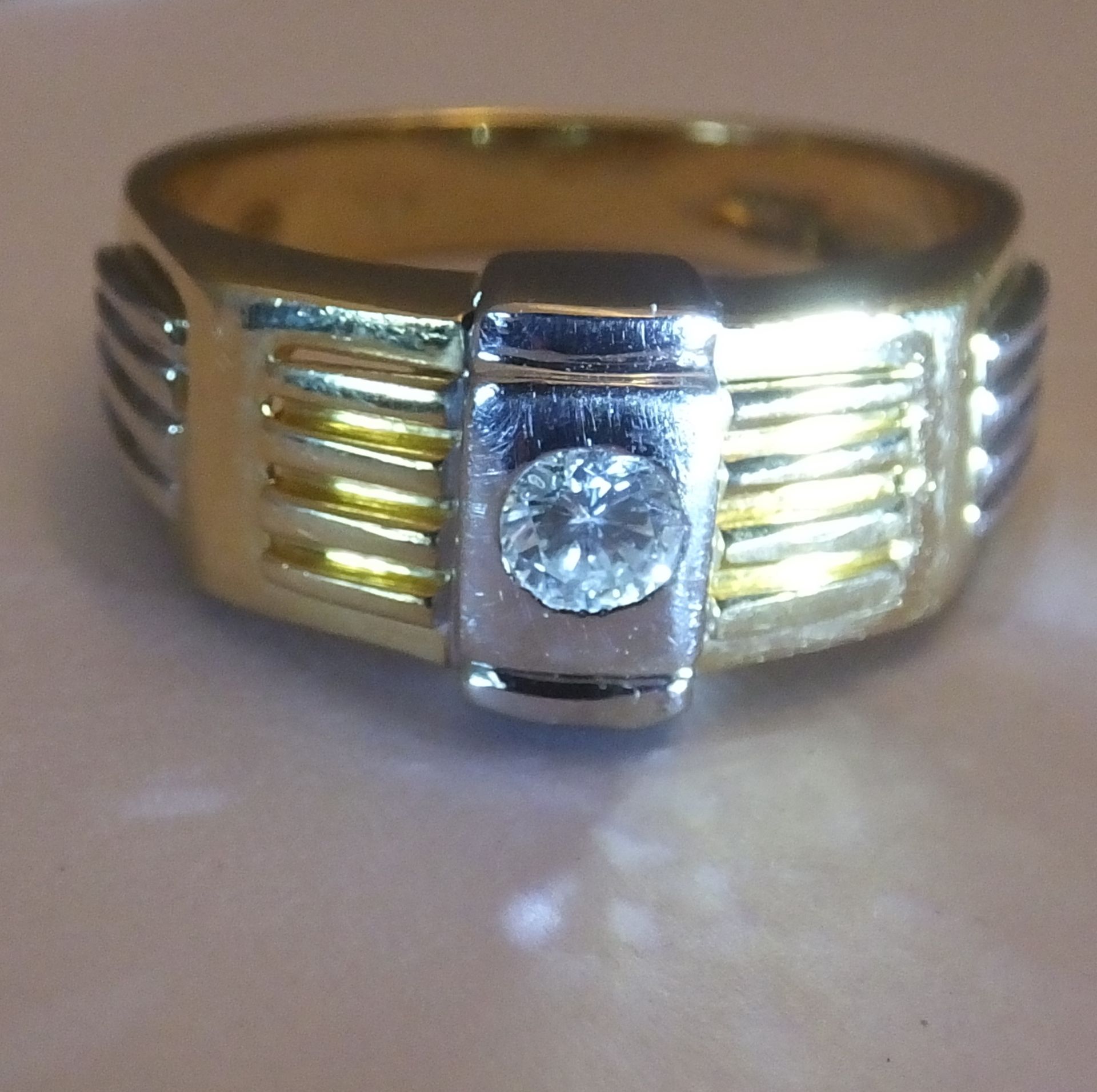 A gentleman's 18ct gold diamond ring. Size T. Of bi-colour design, the brilliant-cut diamond,