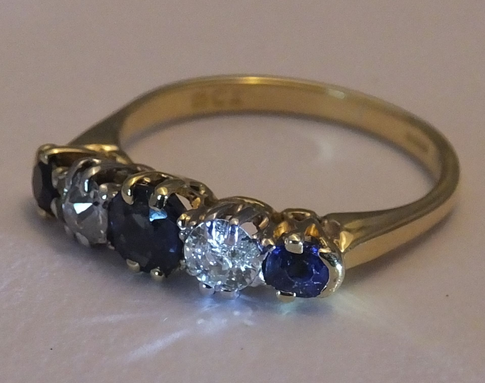 A mid 20th century 18ct gold sapphire and diamond five-stone ring. Size L. The circular-shape - Image 2 of 3