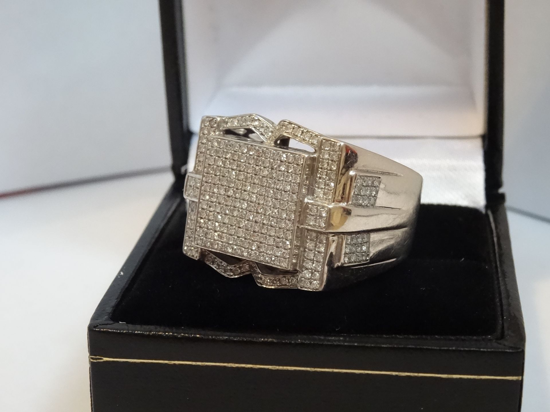 9 Carat White Gold Gents Signet Ring. Contains 1.55 Carats of Diamonds.