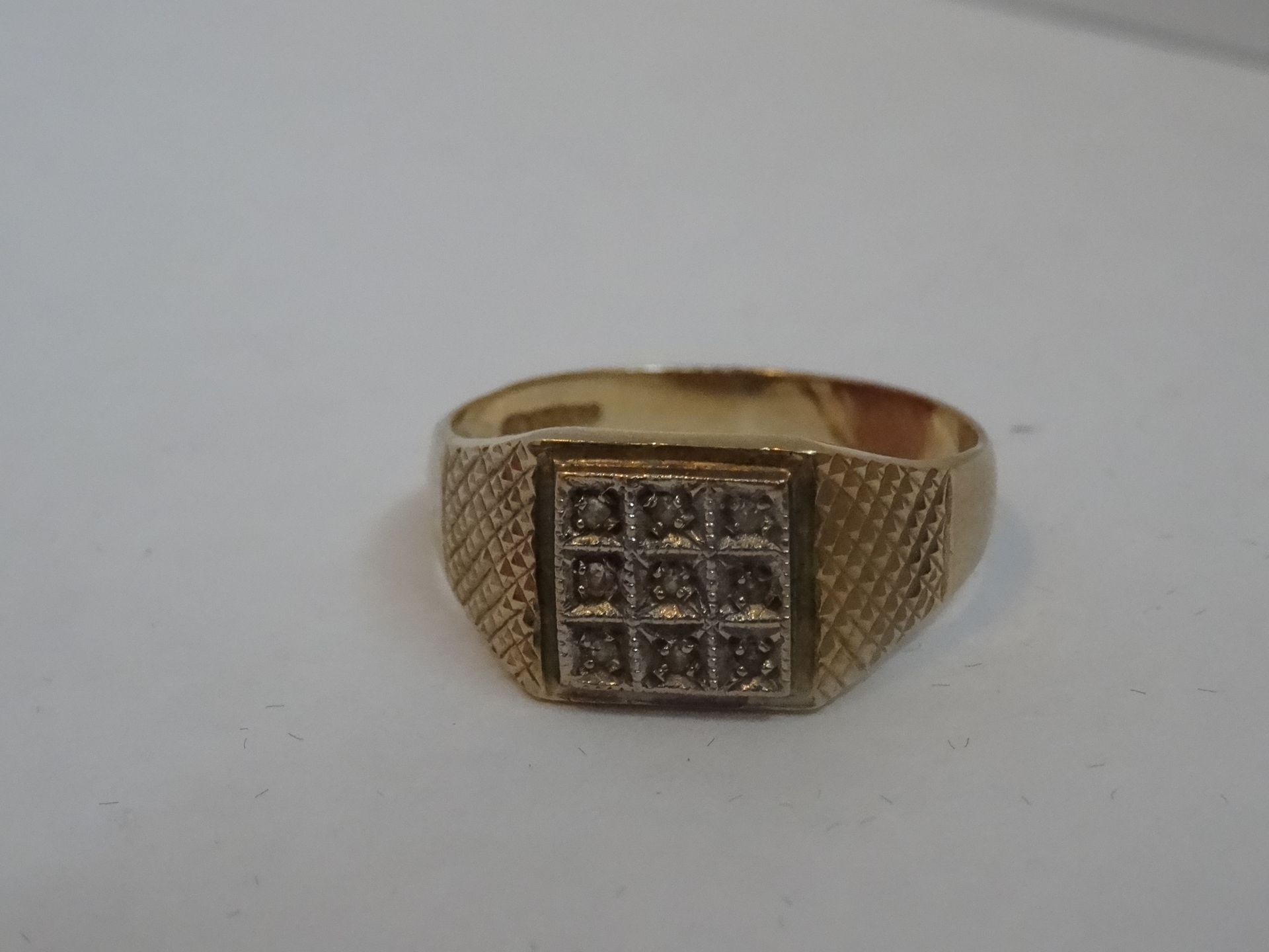 9 Carat Gold Nine Stone Diamond Ring. Total Piece Weight 3.08 Grams
