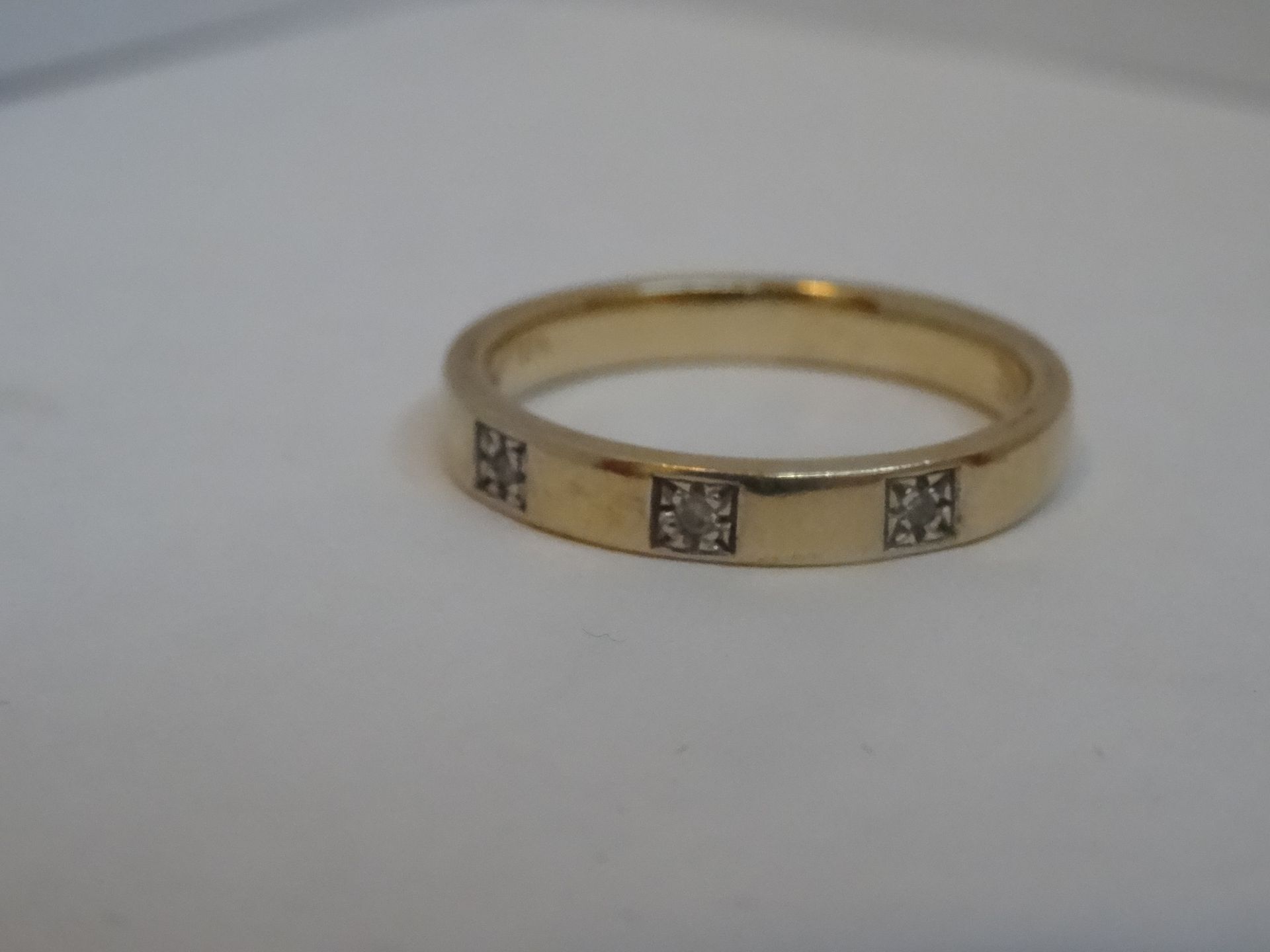 9 Carat Yellow Gold Diamond Band Ring Set with 3 Diamonds. Total Piece Weight 2.91 Grams