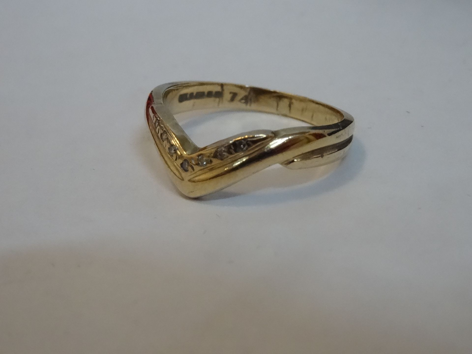 9 Carat Yellow Gold Diamond Wishbone Ring. Total Piece Weight 2.49 Grams