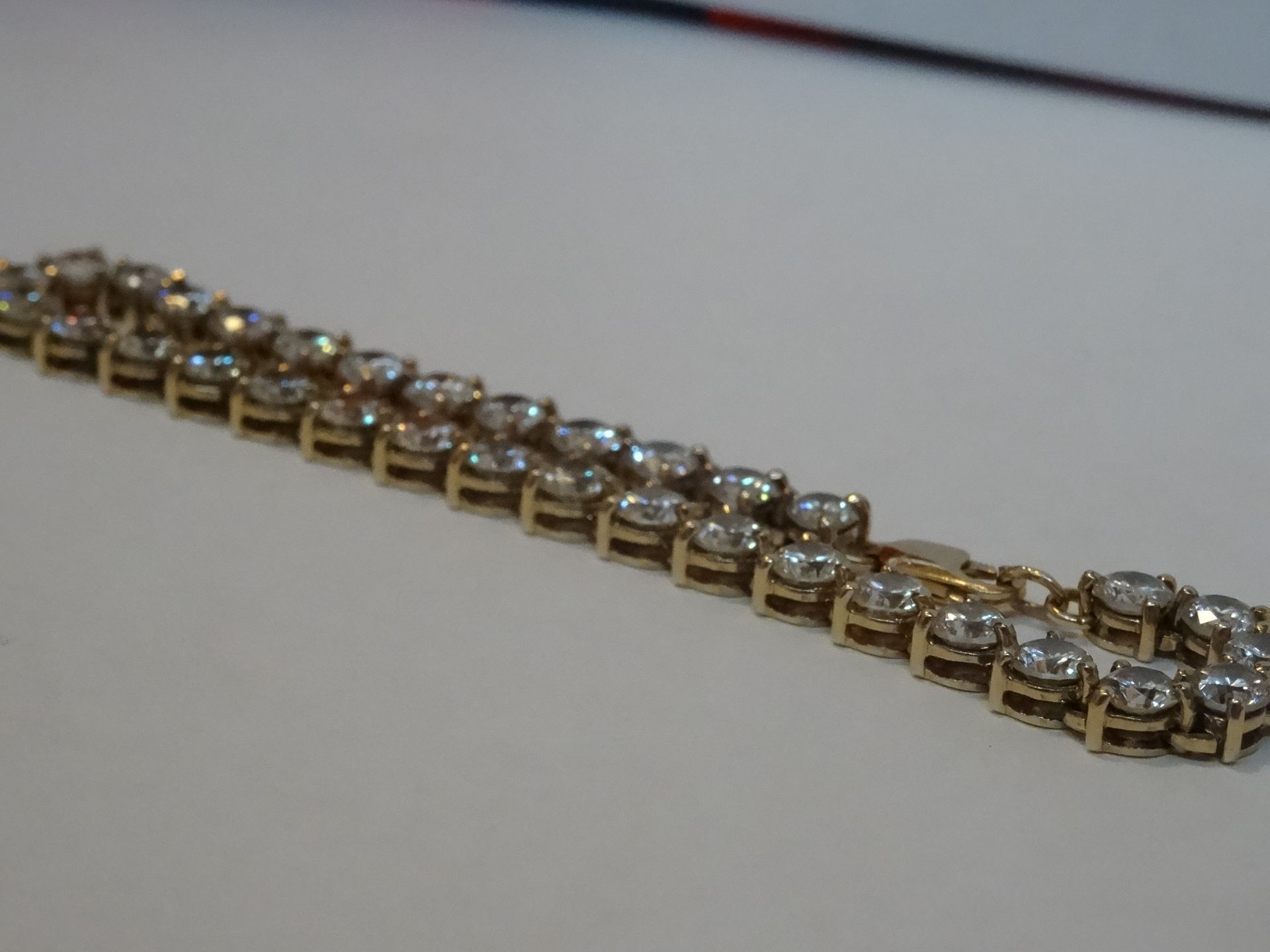 9 Carat Yellow Gold Cubic Zirconia Tennis Bracelet. - Image 3 of 4