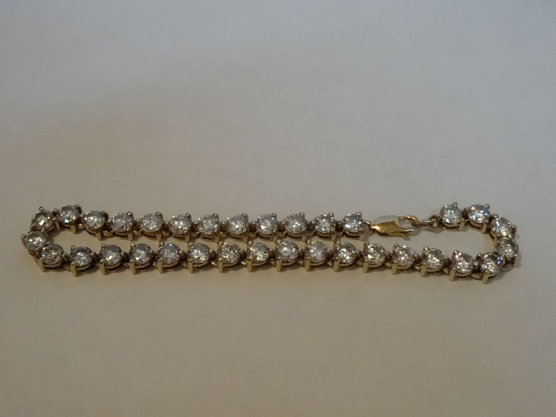 9 Carat Yellow Gold Cubic Zirconia Tennis Bracelet.