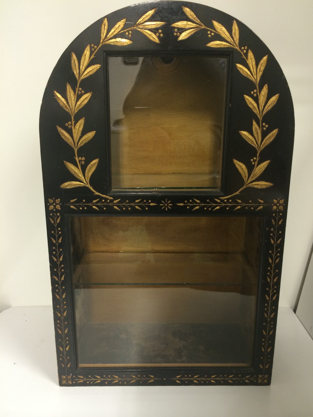 A lovely display cabinet with back light and glass shelf