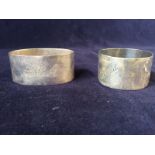 A pair of hallmarked and engraved napkin rings