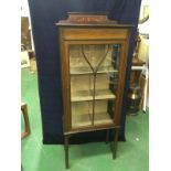 An Edwardian glass fronted display cabinet