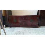 Large Oriental style darkwood sideboard with two sliding doors and six drawers