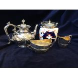 Three piece silver plate tea service and biscuit barrel with sliverplate lid