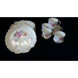 A selection of teacups and saucers by Nymphenburg