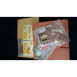 Large selection of Mint stamps on sheets and bagged volumes of individual mint stamps.