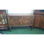 A medium oak sideboard