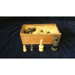 Vintage chess pieces in wooden box