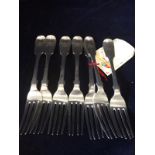A set of seven silver dessert forks
