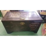 Large oriental carved camphor wood trunk made by Jimmy Choy & Co. of Kowloon Hong Kong. With