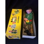 Pelham Puppet Giant, composition moulded features, black woollen wig, wearing green tunic, red and