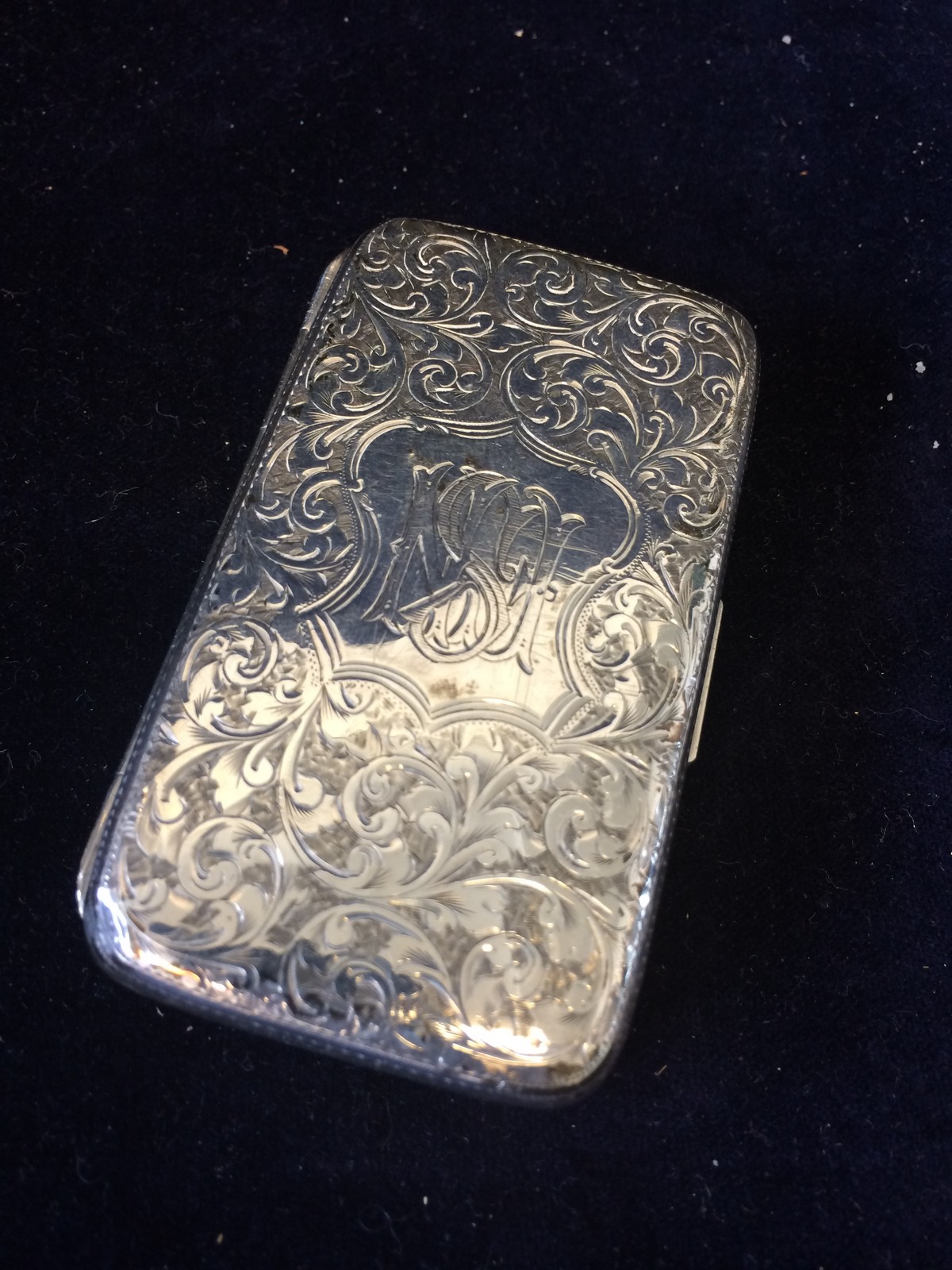 A small silver cigarette case Hallmarked Chester 1895