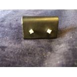 A brand new pair of diamond stud earrings