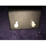 A pair of diamond earrings