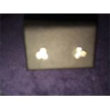 A brand new pair of diamond earrings