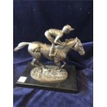 A bronze group, in the form of a horse with a jockey up, on a plinth, signed David Cornell 1985,