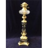 An outstanding example of a Hinks And Sons Oil Lamp set on a brass and bronze column with assorted