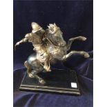 "Il Cavallo", modern, a bronze figure of a Renaissance soldier on a rearing horse, ebonised wood