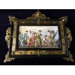A pair of Italian ornately framed hand painted porcelain plaques