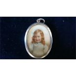 A Locket style, silver cased with glass front, painted miniature on paper.  Hall marked London 1910