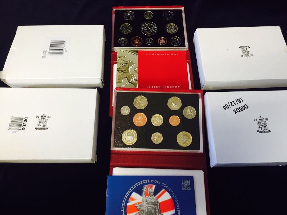 Royal Mint year proof sets in original boxes. 1998, 2001- 2005.